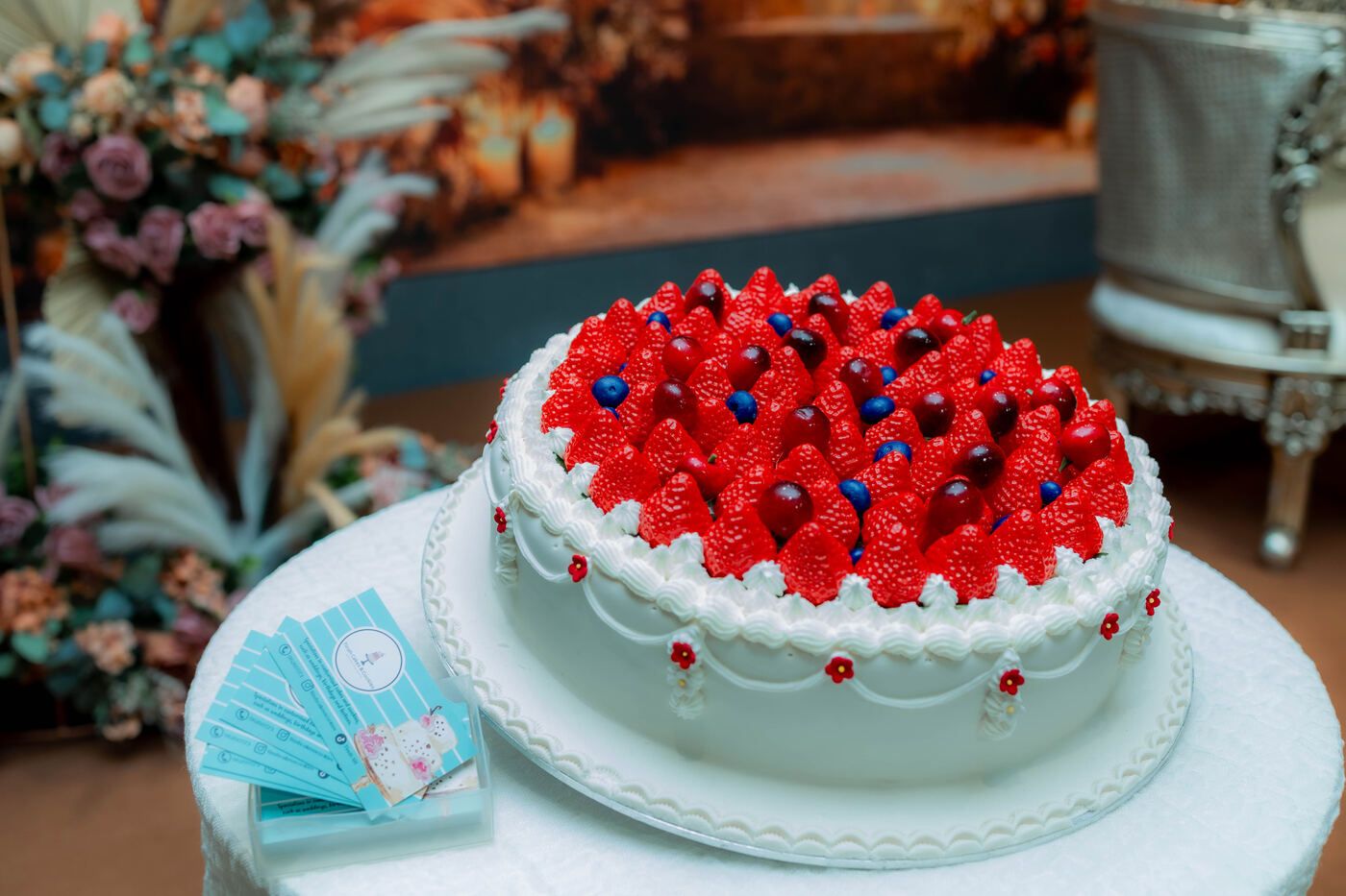 Celebration cake table with wedding decor