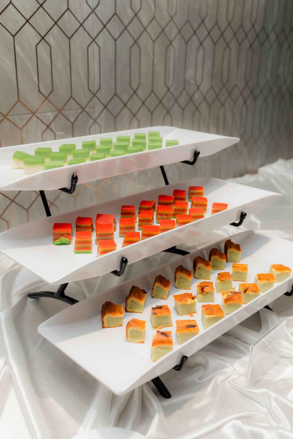 Vertical dessert tray with colourful bite-sized desserts
