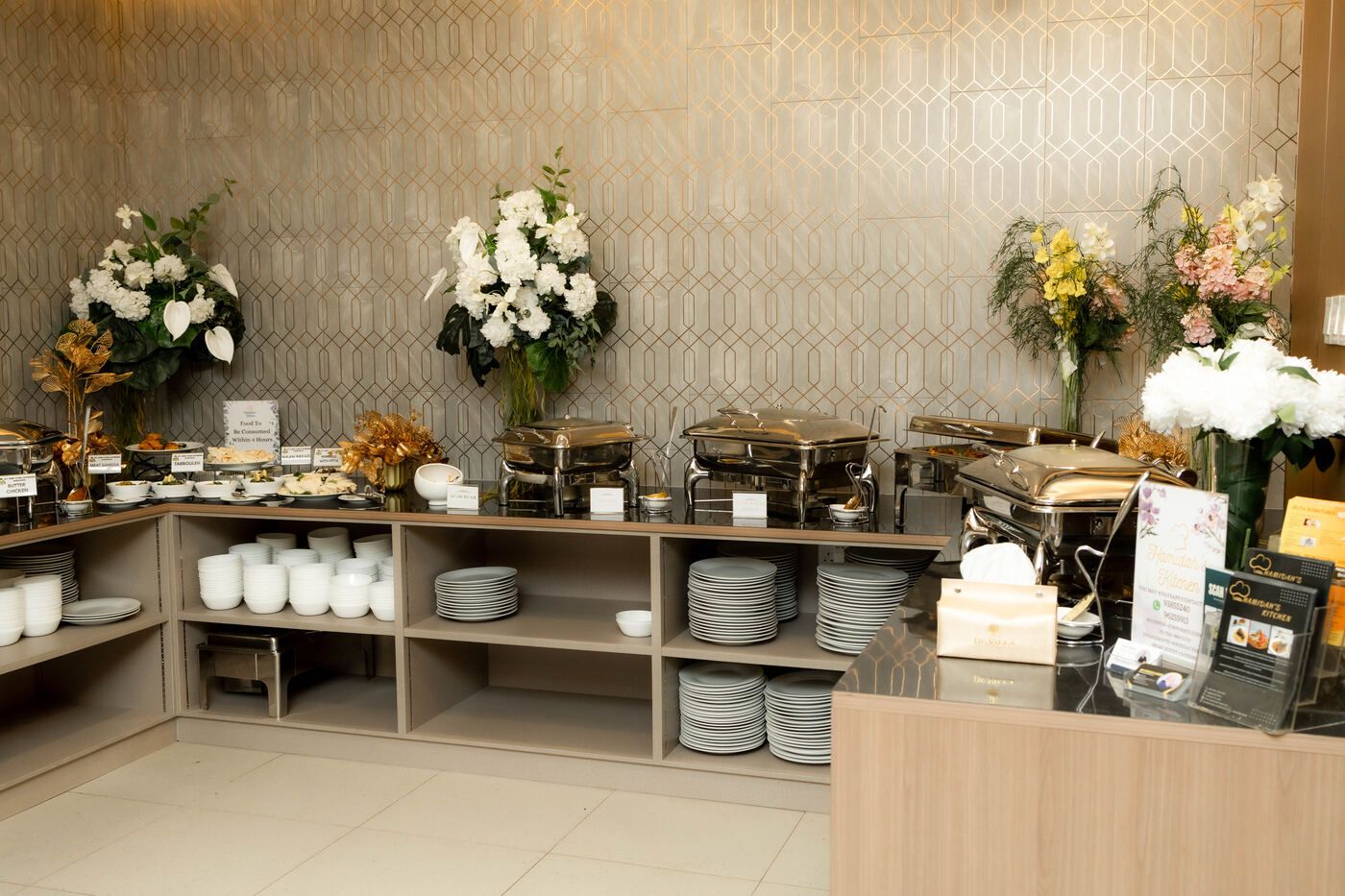 Buffet station with serving warmers and plates