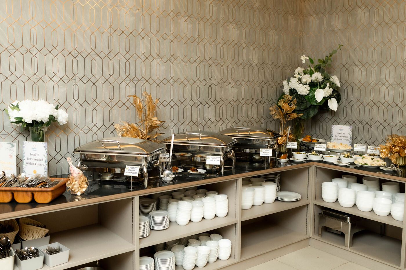 Buffet layout with serving dishes and plate station