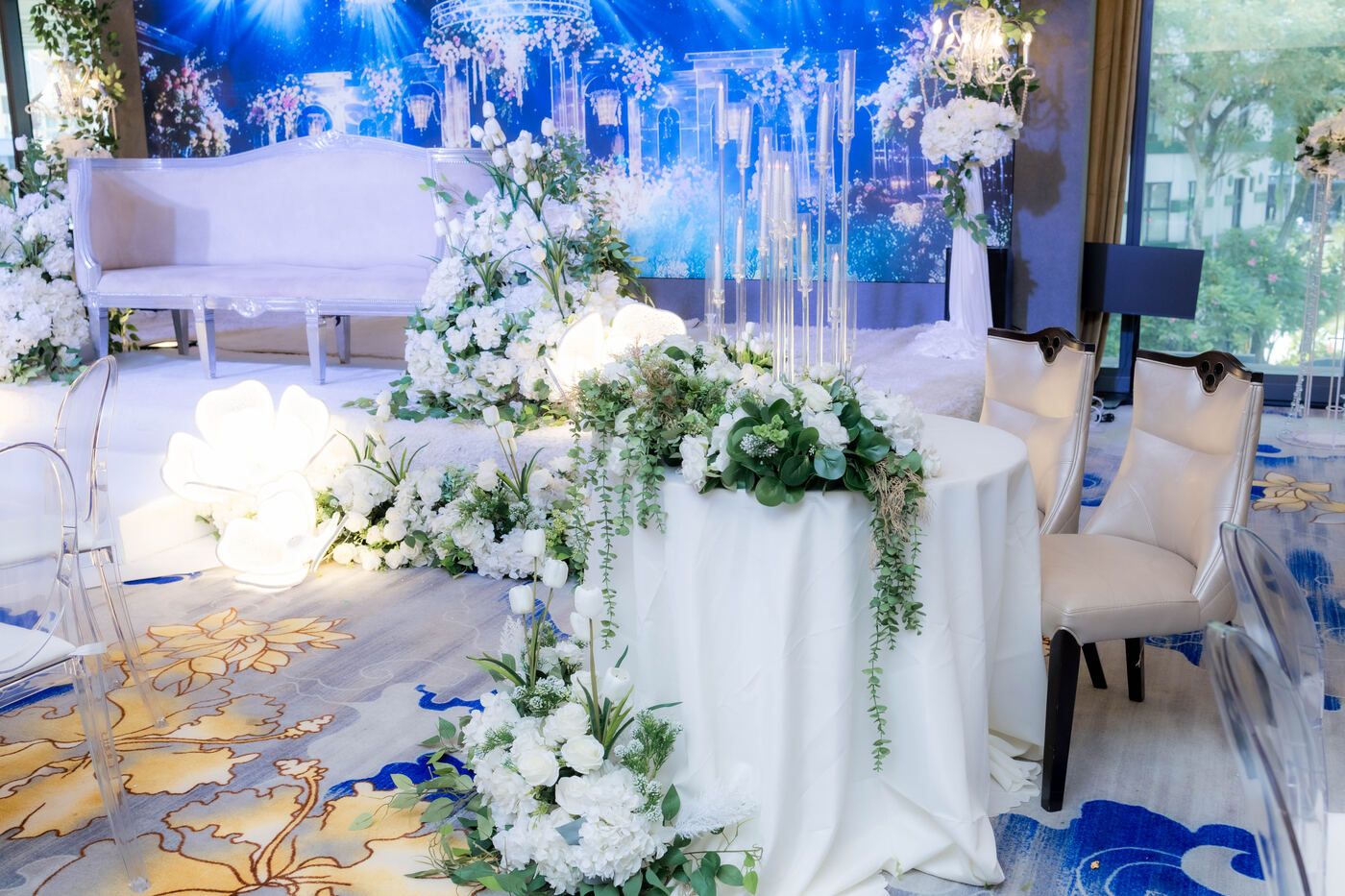 White floral wedding stage setup at De Villa