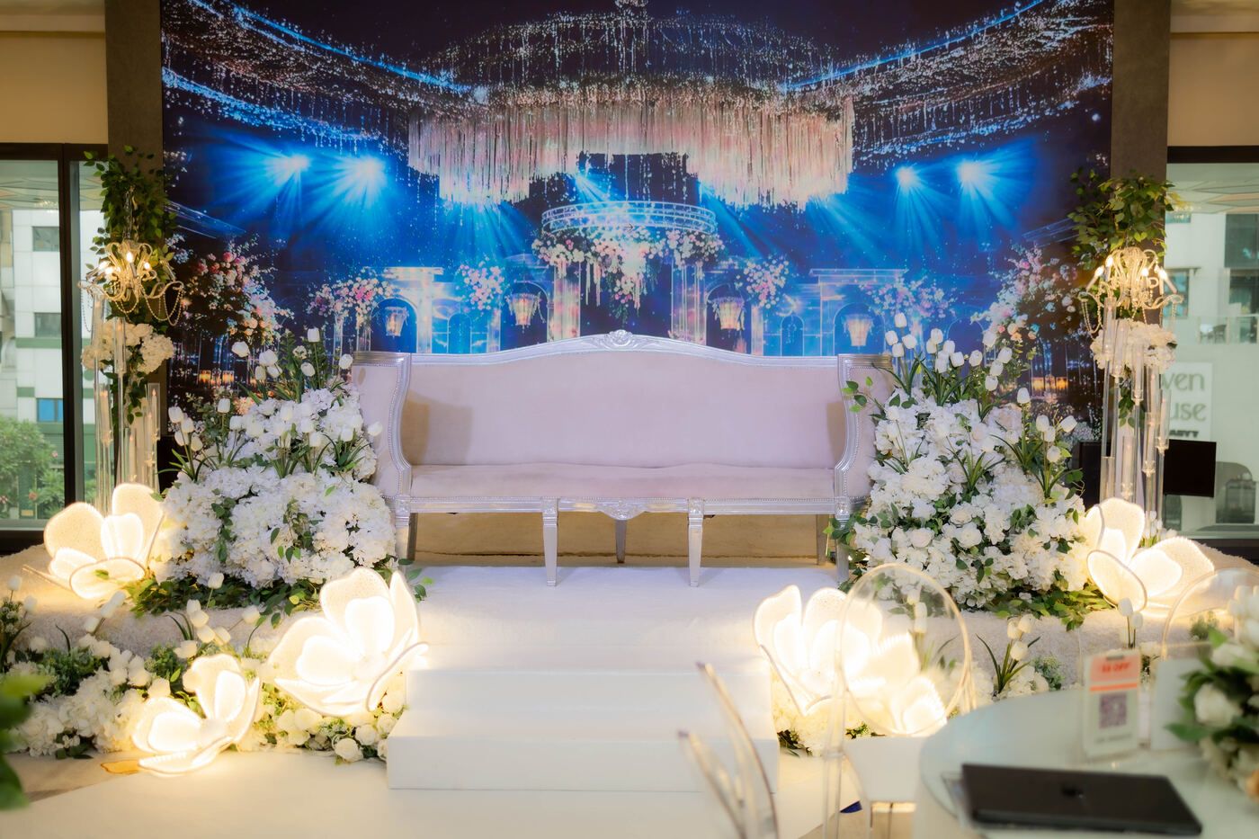 Wedding ceremony stage with floral aisle styling